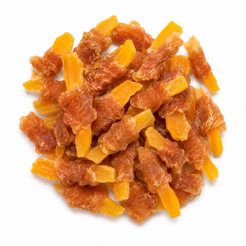 A pile of dried orange-yellow fruit pieces, likely apricots or dried mangoes, on a plain white background.