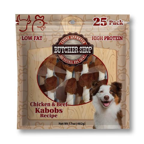A 25-pack bag of Butcher Shop Chicken & Beef Kabobs dog treats, featuring a brown and beige wood-grain patterned package with a circular clear window showing the treats inside, and a smiling dog illustration on the bottom right.