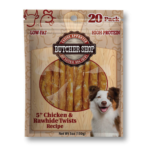 A 20-pack bag of Butcher Shop Natural Dog Chow 5-inch chicken and rawhide twists recipe dog treats. The packaging features a wood-grain pattern background, a circular clear window showing the golden-brown twisted treats inside, and a smiling brown and white dog on the lower right.