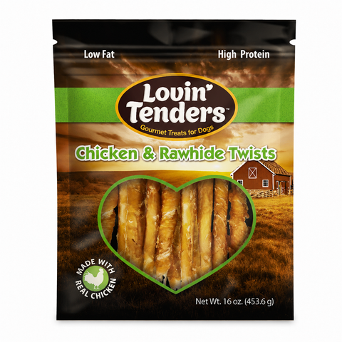 A 16 oz bag of Lovin Tenders Chicken & Rawhide Twists dog treats, featuring a heart-shaped window showing the golden-brown twisted treats inside. The packaging has a brown and black background with a green stripe and a red barn illustration.