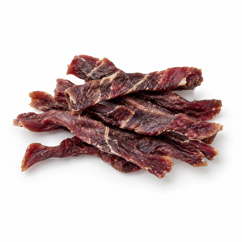 A pile of thin, dark red-brown beef jerky strips with visible white fat marbling, arranged on a clean white background.