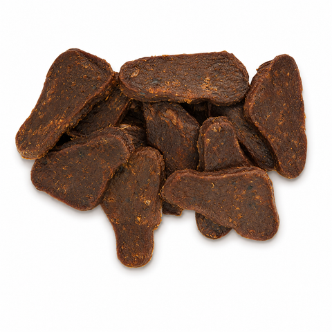 A pile of dark brown, bone-shaped dog treats with a textured, chewy surface, isolated on a white background.