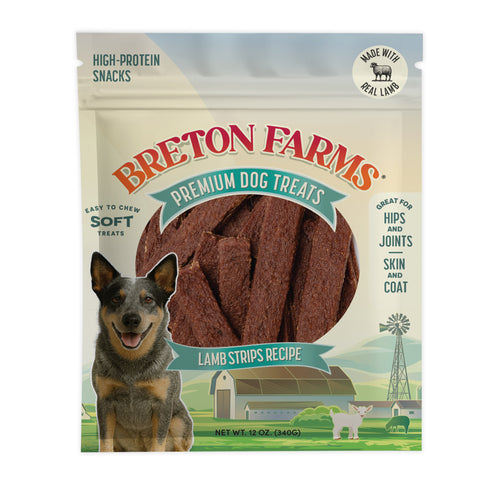 A package of Breton Farms Premium Dog Treats, Lamb Strips Recipe, in a 12 oz resealable stand-up pouch. The packaging features a smiling blue heeler dog, a farm illustration, and a clear window showing the brown lamb strips inside.